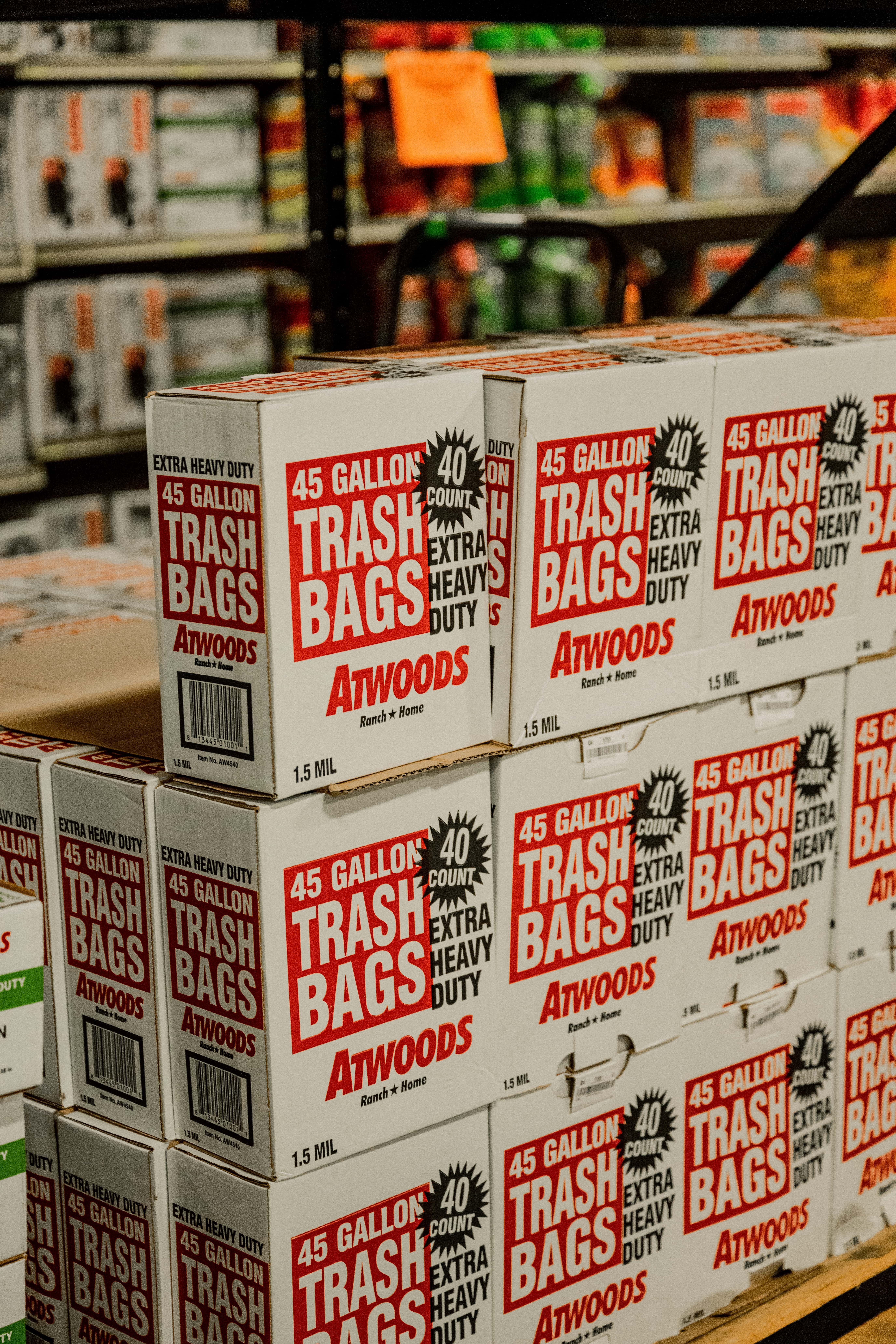 Closeup of rake pulling leaves across grass